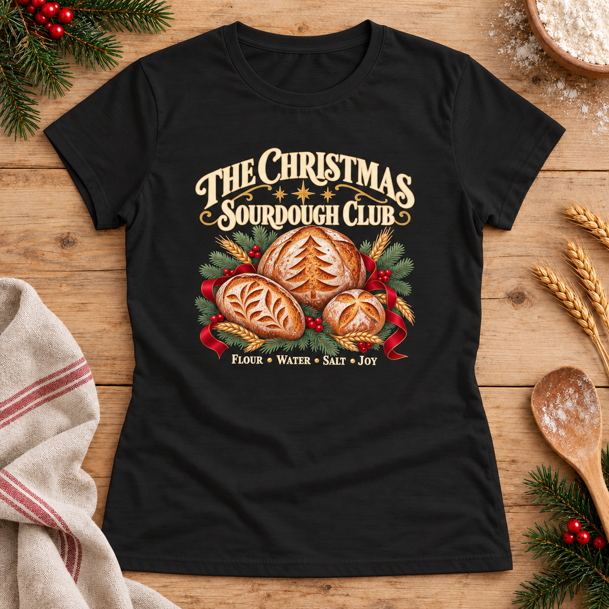 Christmas Sourdough Club — Black Gildan 64000L women’s semi-fitted tee, styled flat lay