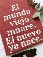 El Mundo Viejo Muere El Nuevo Ya Nace Spanish Spiritual T-Shirt Latino Heritage Awakening Tee